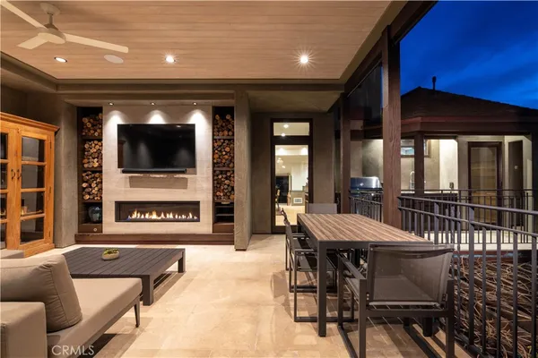 a view of a dining room with furniture and chandelier