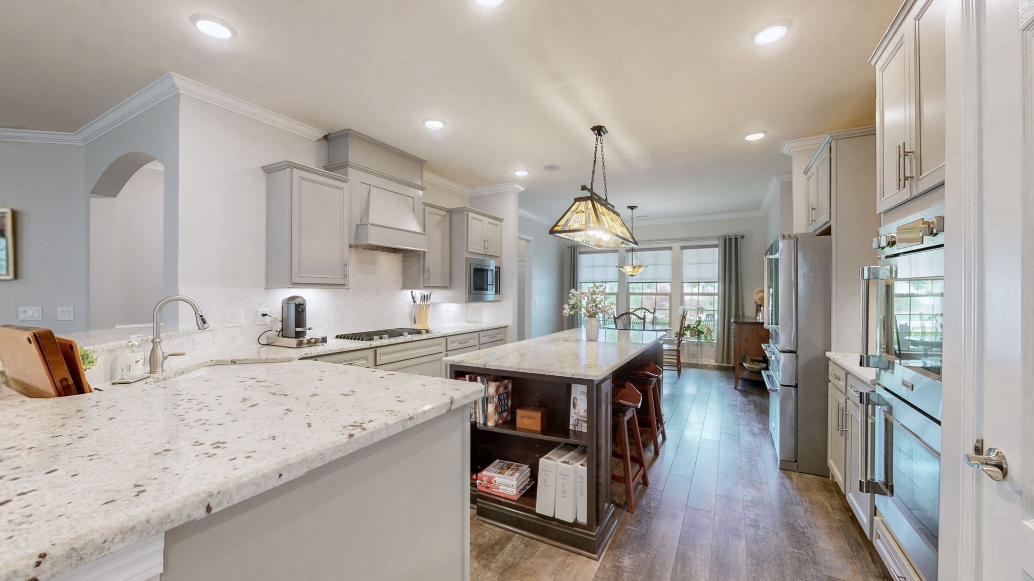1106 Davidson Walk Spring Hill, TN 37174 - Photo 14 of 61 a kitchen with a sink a center island stainless steel appliances and cabinets
