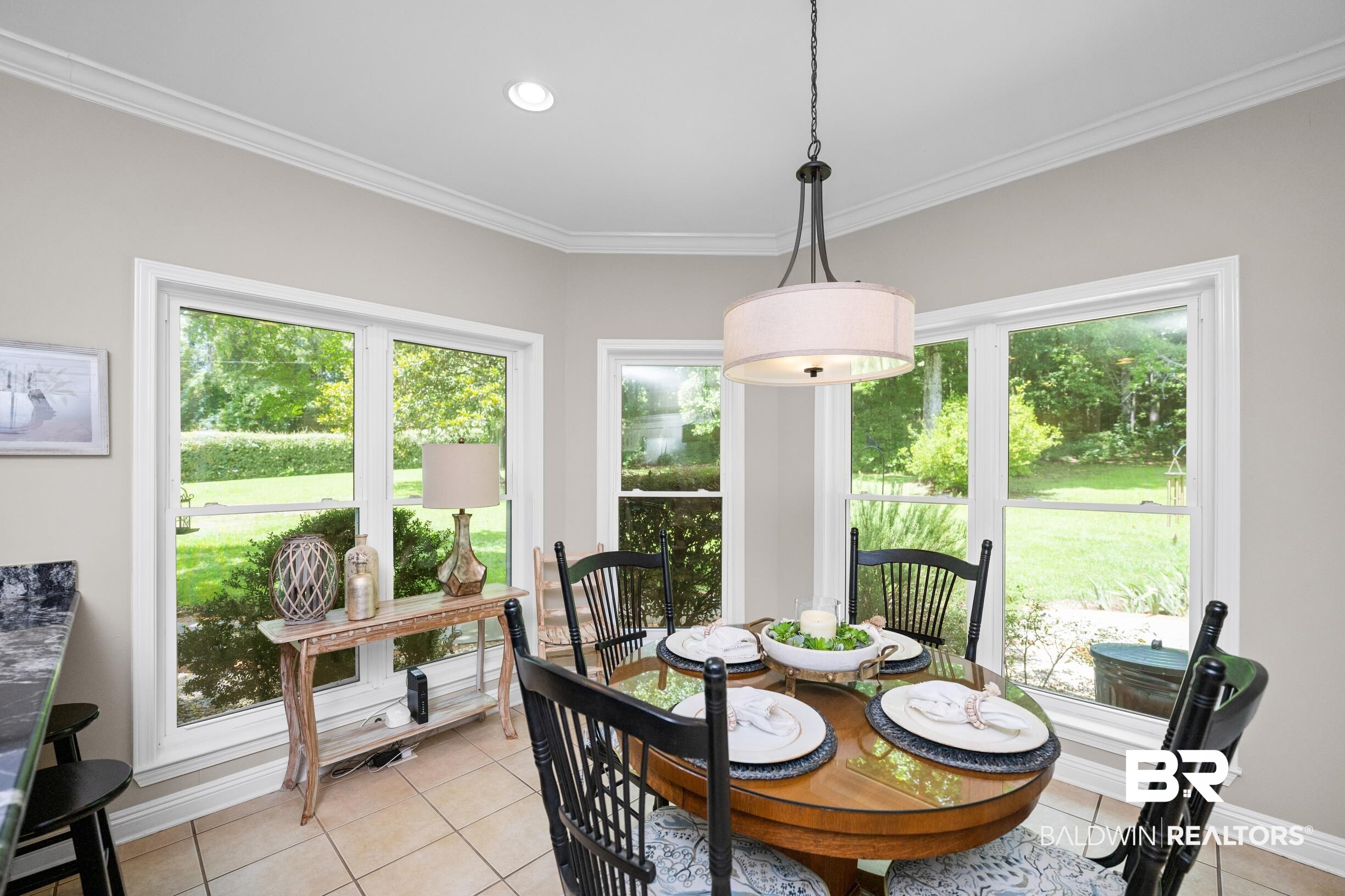 196 Morning Ridge Road Monroeville, AL 36460 - Photo 22 of 71 Dining area featuring light tile patterned flooring and ornamental molding