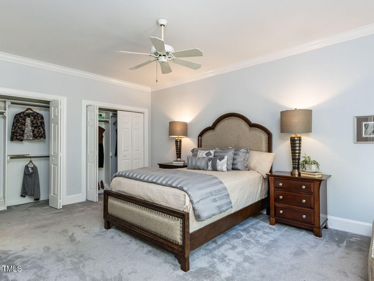 315 King George Loop Cary, NC 27511 - Photo 15 of 39 a bedroom with a bed lamp and dresser