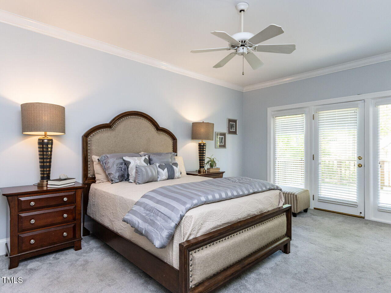315 King George Loop Cary, NC 27511 - Photo 16 of 39 a bedroom with a bed and a chandelier
