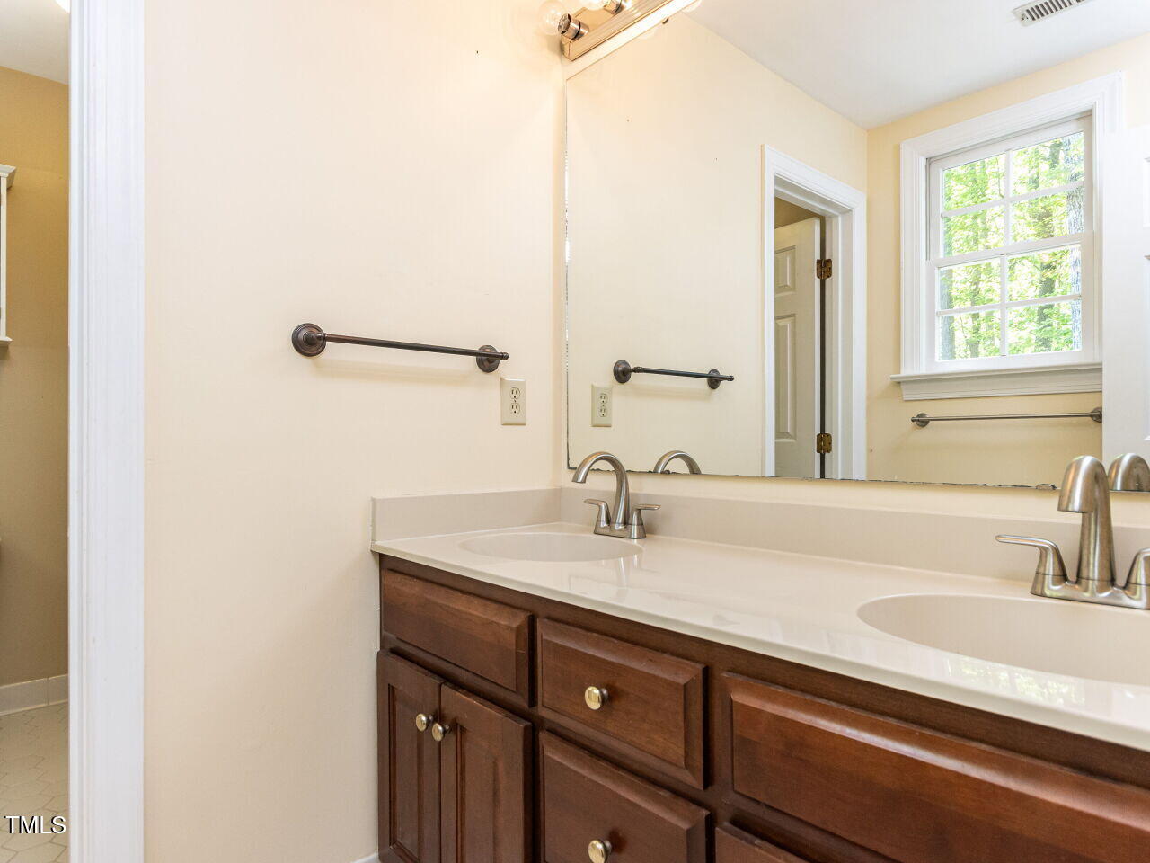 315 King George Loop Cary, NC 27511 - Photo 22 of 39 a bathroom with a sink and a mirror