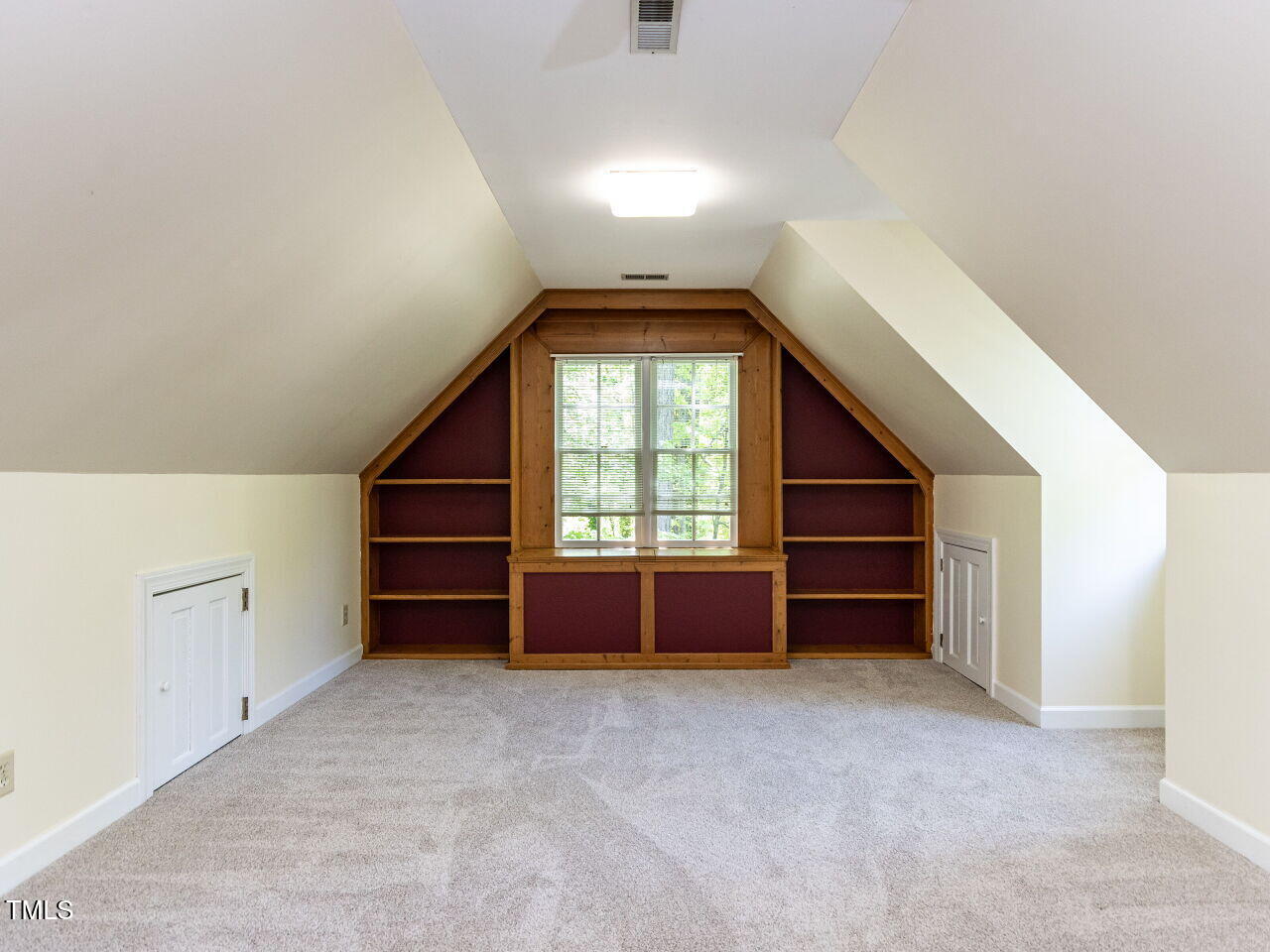 315 King George Loop Cary, NC 27511 - Photo 28 of 39 an empty room with a fireplace and windows