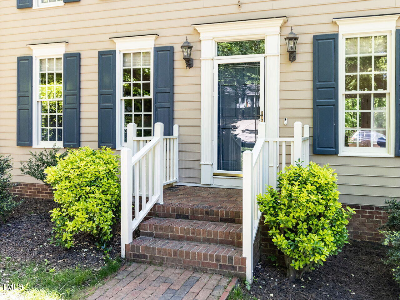 315 King George Loop Cary, NC 27511 - Photo 3 of 39 a front view of a house with a garden