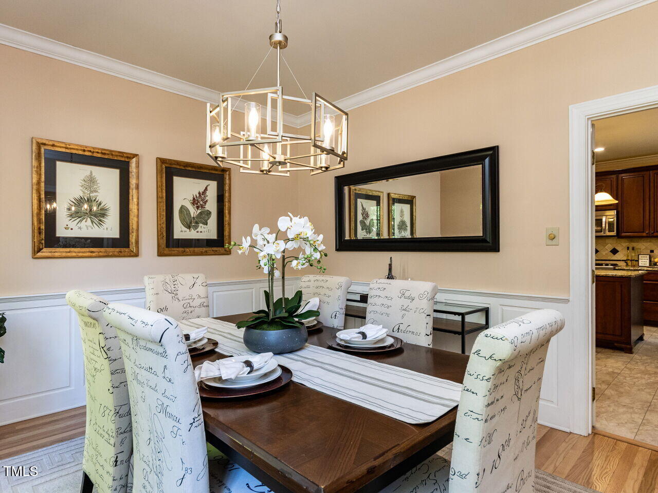 315 King George Loop Cary, NC 27511 - Photo 5 of 39 a view of a dining room with furniture a chandelier and wooden floor