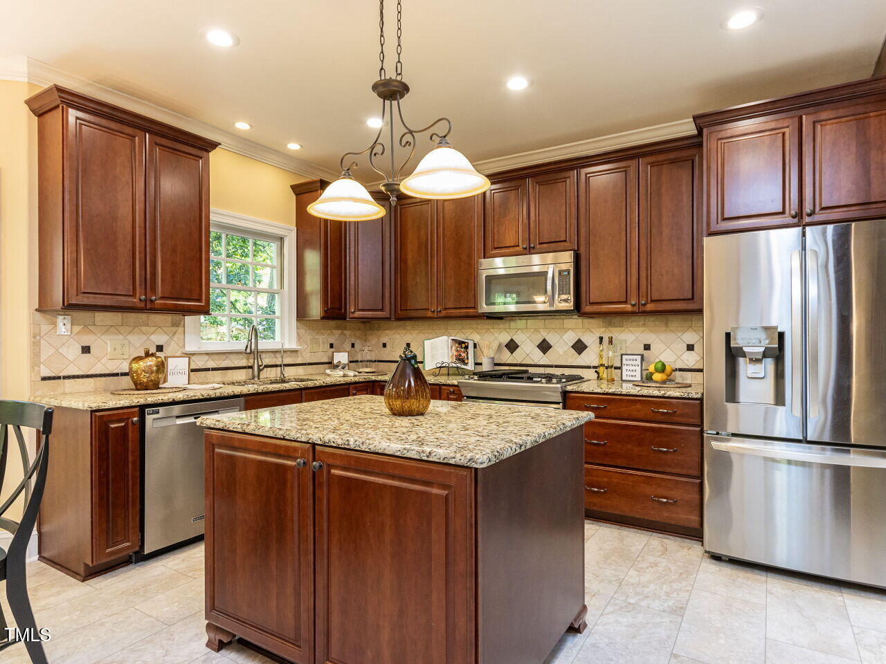 315 King George Loop Cary, NC 27511 - Photo 6 of 39 a kitchen with stainless steel appliances granite countertop a stove refrigerator sink and microwave