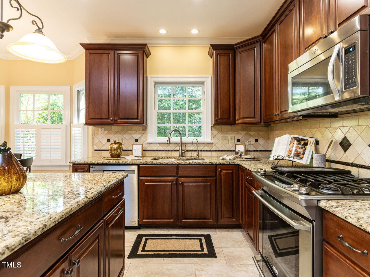315 King George Loop Cary, NC 27511 - Photo 7 of 39 a kitchen with a sink stove top oven and microwave