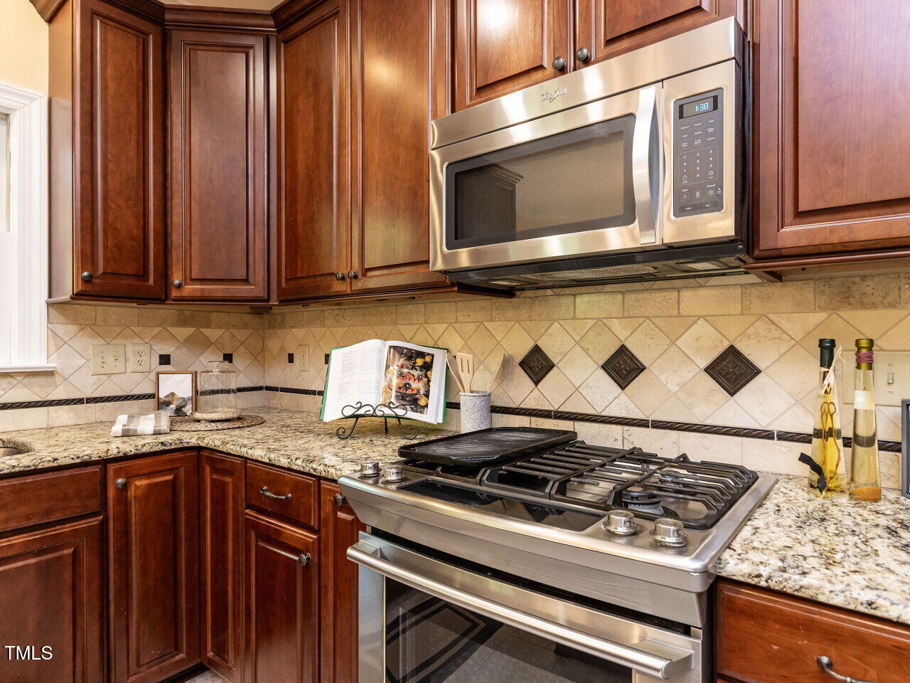 315 King George Loop Cary, NC 27511 - Photo 8 of 39 a stove top oven sitting inside of a kitchen