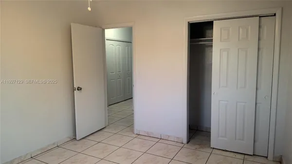 a bathroom with a sink a window and shower