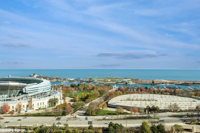 an aerial view of residential building and ocean view