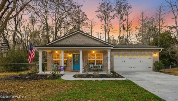 a front view of a house with garden