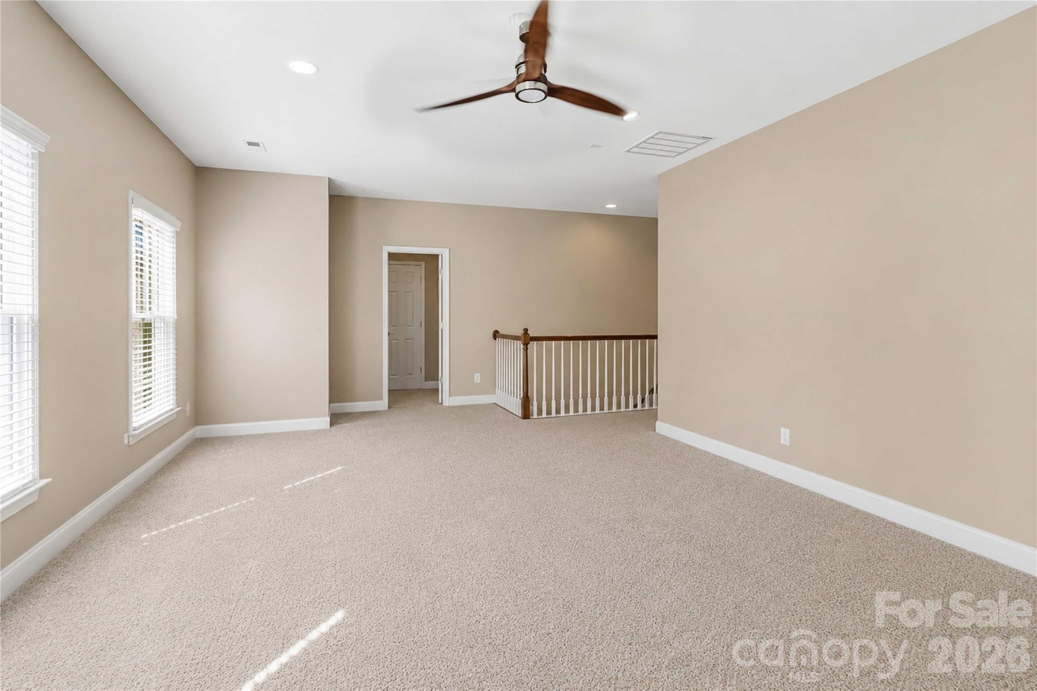 2436 Commons Court Fort Mill, SC 29708 - Photo 36 of 43 a view of empty room with windows