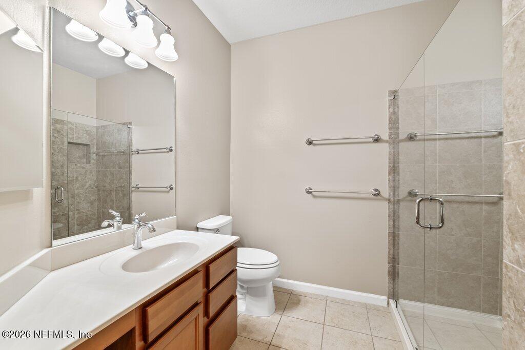 8757 Little Swift Circle, Unit 22F Jacksonville, FL 32256 - Photo 11 of 46 a bathroom with a sink vanity granite and toilet