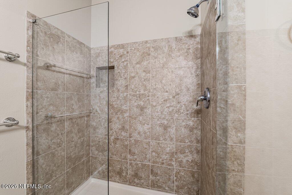 8757 Little Swift Circle, Unit 22F Jacksonville, FL 32256 - Photo 12 of 46 a bathroom with a shower