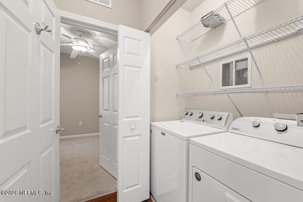 8757 Little Swift Circle, Unit 22F Jacksonville, FL 32256 - Photo 13 of 46 a utility room with dryer and washer