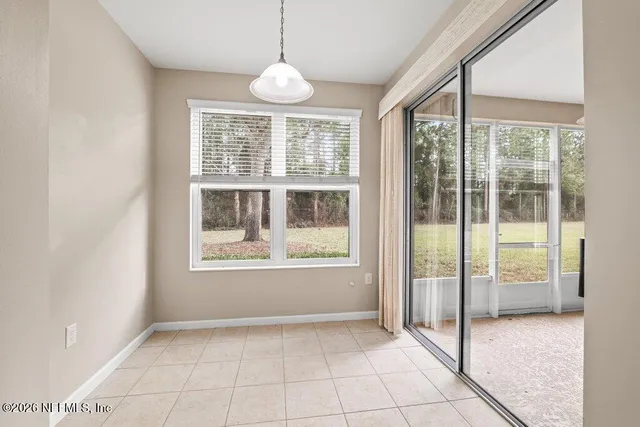 a view of a kitchen with a sink and wooden floor