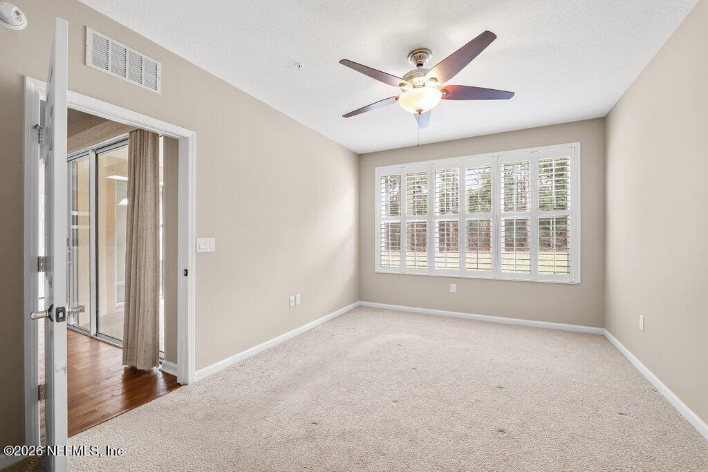 8757 Little Swift Circle, Unit 22F Jacksonville, FL 32256 - Photo 26 of 46 a view of an empty room with a window
