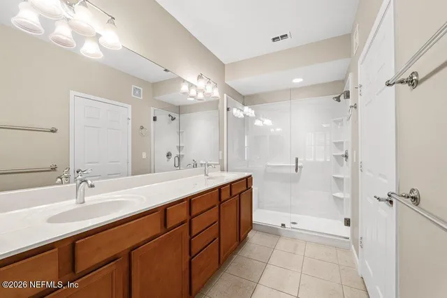 a bathroom with a shower and a sink