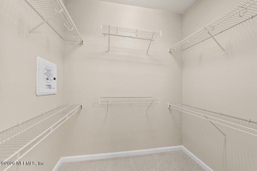 8757 Little Swift Circle, Unit 22F Jacksonville, FL 32256 - Photo 32 of 46 a view of a room with racks on the wall