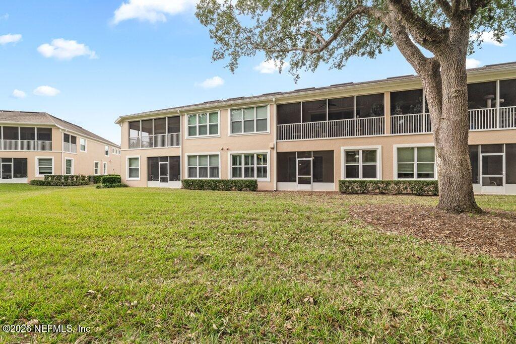 8757 Little Swift Circle, Unit 22F Jacksonville, FL 32256 - Photo 35 of 46 a front view of a building with a garden