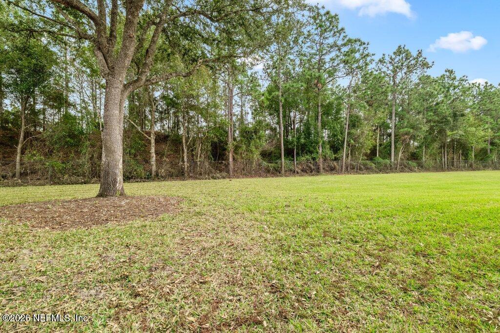 8757 Little Swift Circle, Unit 22F Jacksonville, FL 32256 - Photo 36 of 46 a view of a ground with a trees