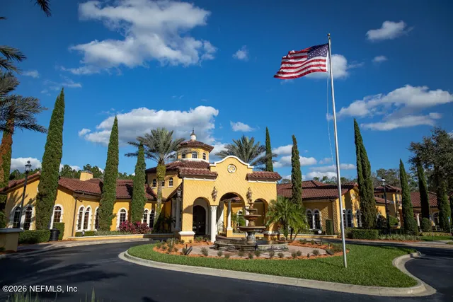 a backyard of a house with outdoor seating