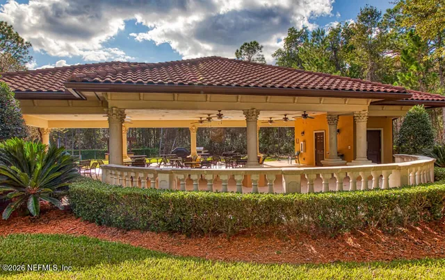 a view of a cafe with a table and chairs