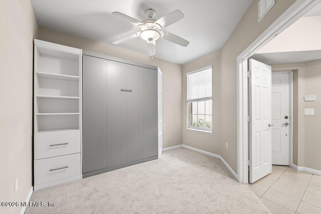 8757 Little Swift Circle, Unit 22F Jacksonville, FL 32256 - Photo 7 of 46 a view of an empty room with a window