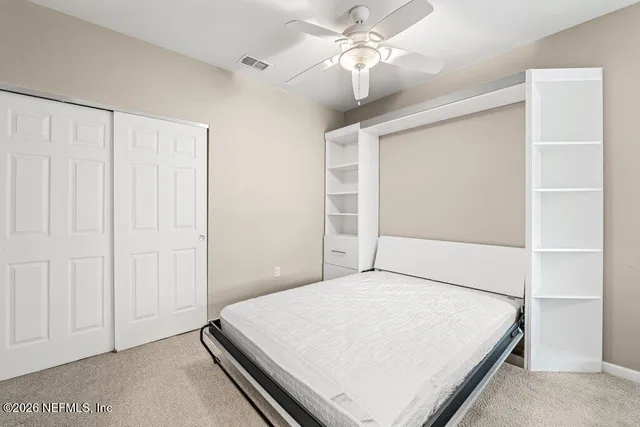 a view of a bathroom with wooden floor