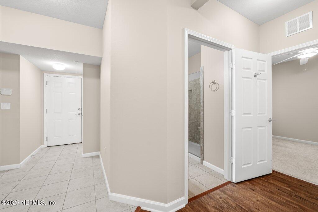 8757 Little Swift Circle, Unit 22F Jacksonville, FL 32256 - Photo 10 of 46 a view of a bathroom with wooden floor
