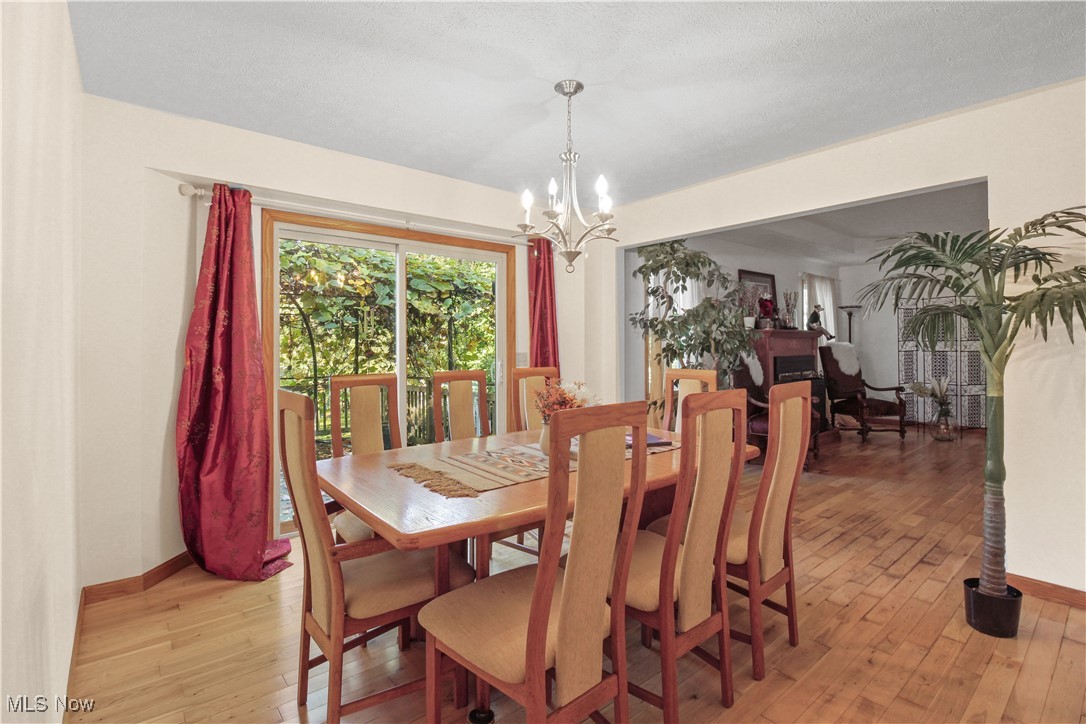 2632 Berry Road Akron, OH 44320 - Photo 10 of 39 Dining space featuring light hardwood / wood-style flooring and a chandelier