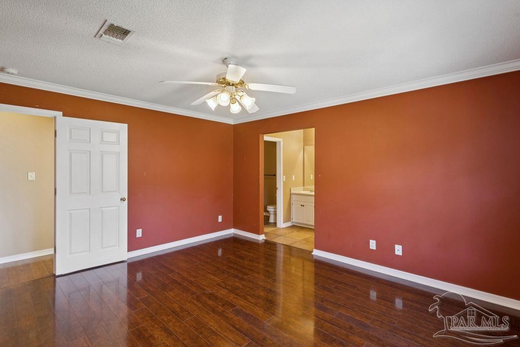 5661 Berrybrook Circle Pace, FL 32571 - Photo 18 of 21 wooden floor in an empty room with a window