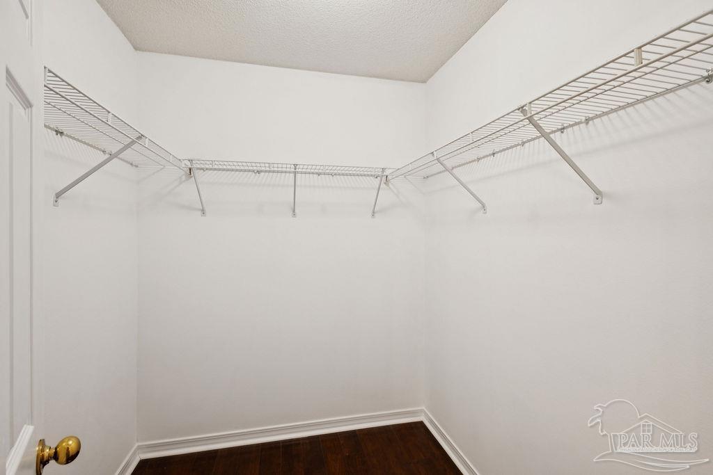 5661 Berrybrook Circle Pace, FL 32571 - Photo 20 of 21 a view of a room with racks on the wall