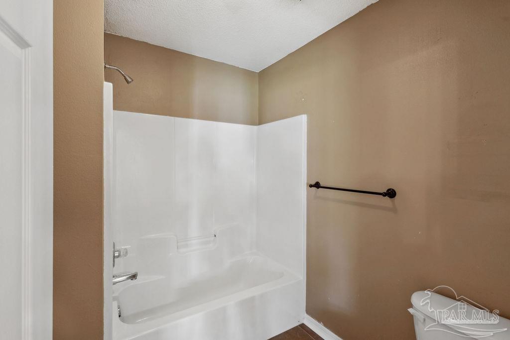 5661 Berrybrook Circle Pace, FL 32571 - Photo 21 of 21 a bathroom with a bathtub and toilet