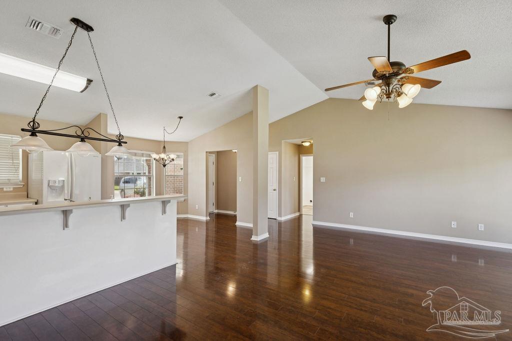 5661 Berrybrook Circle Pace, FL 32571 - Photo 4 of 21 a view of a room with wooden floor