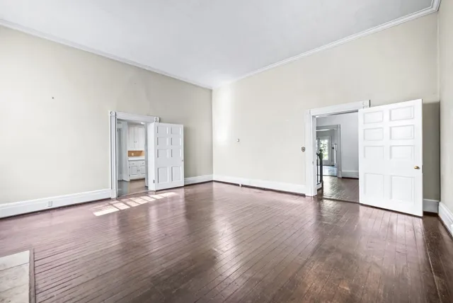a kitchen with a sink cabinets stainless steel appliances and a window