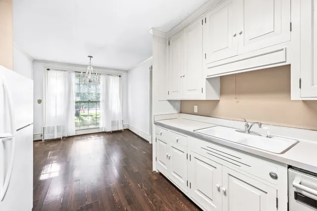 a kitchen with stainless steel appliances a refrigerator and a stove