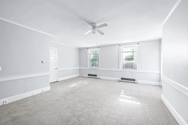 a kitchen with a stove a sink and a refrigerator