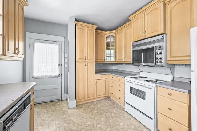 a view of an empty room and wooden floor