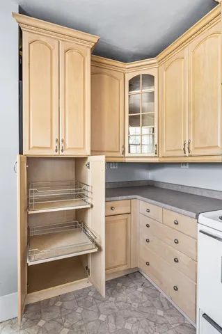 a view of a room with wooden floor and window