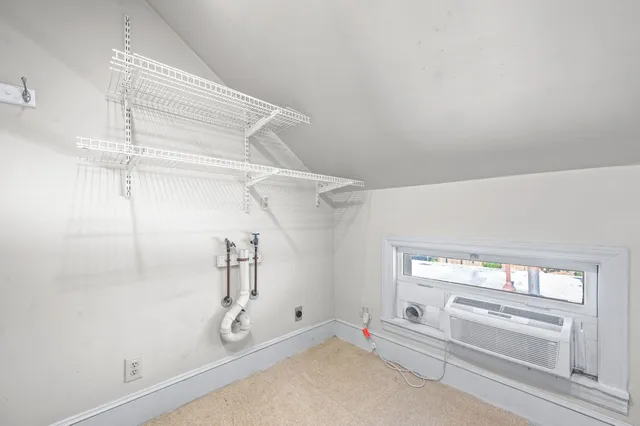 a front view of a building with garden