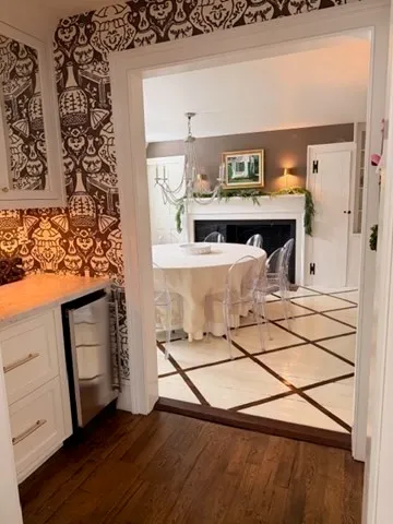 a view of living room with furniture and wooden floor
