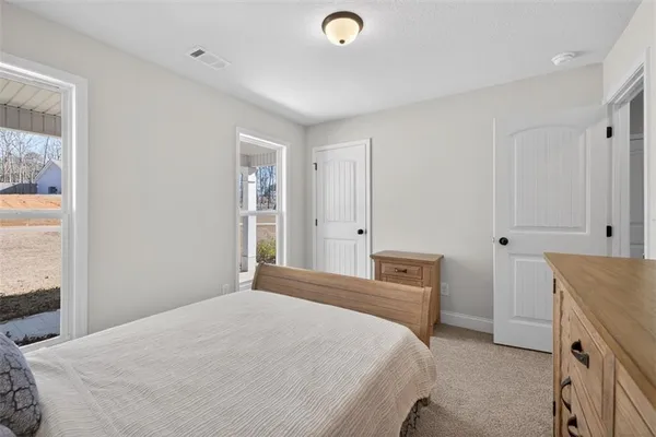 a bedroom with a bed and a cabinets