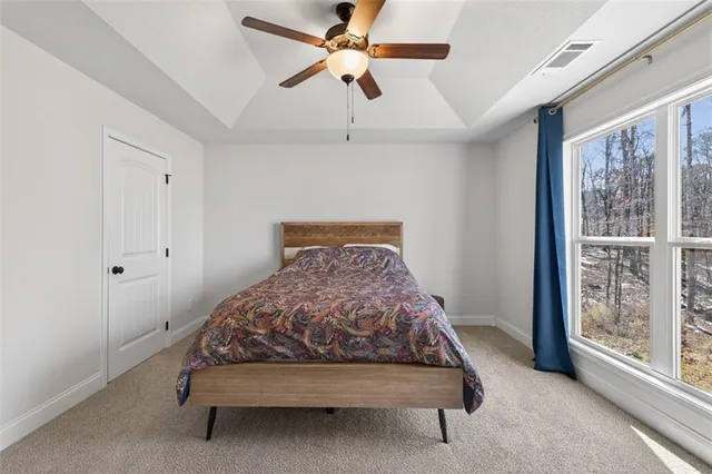 a bedroom with a bed and window