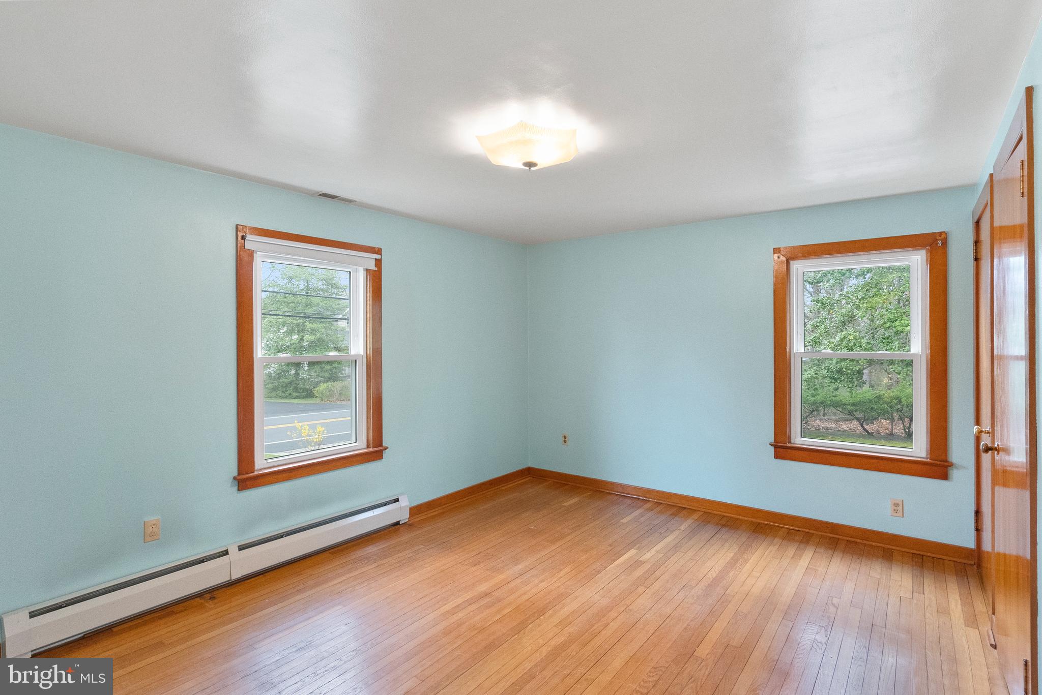 1155 South Fairview Street Delran, NJ 08075 - Photo 16 of 24 an empty room with wooden floor and windows