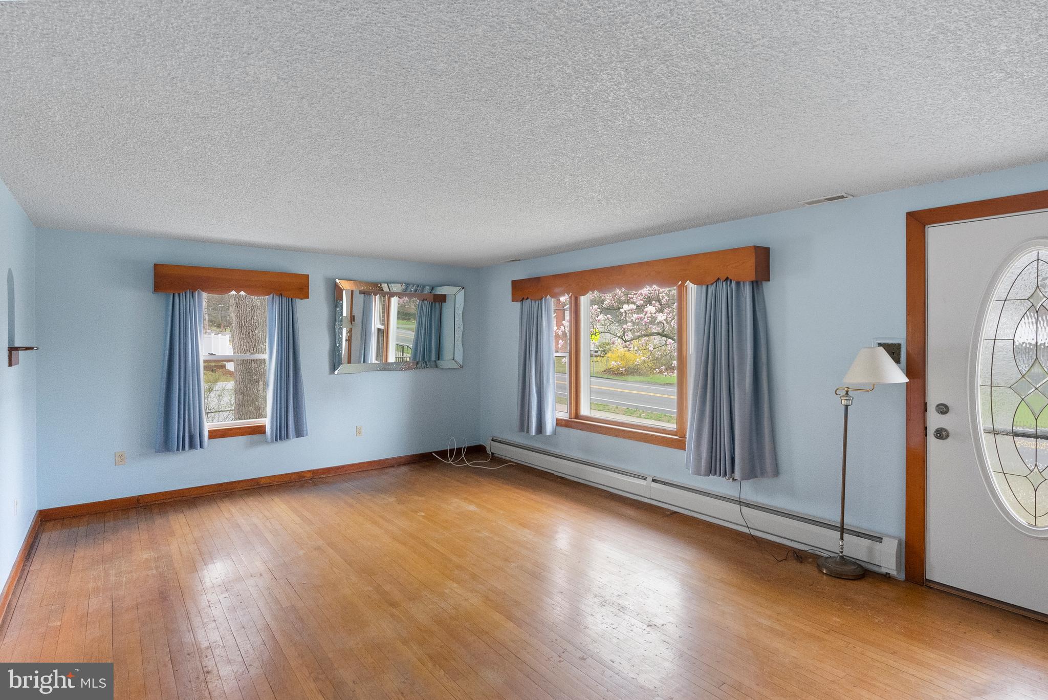 1155 South Fairview Street Delran, NJ 08075 - Photo 7 of 24 a view of an empty room with a window and wooden floor