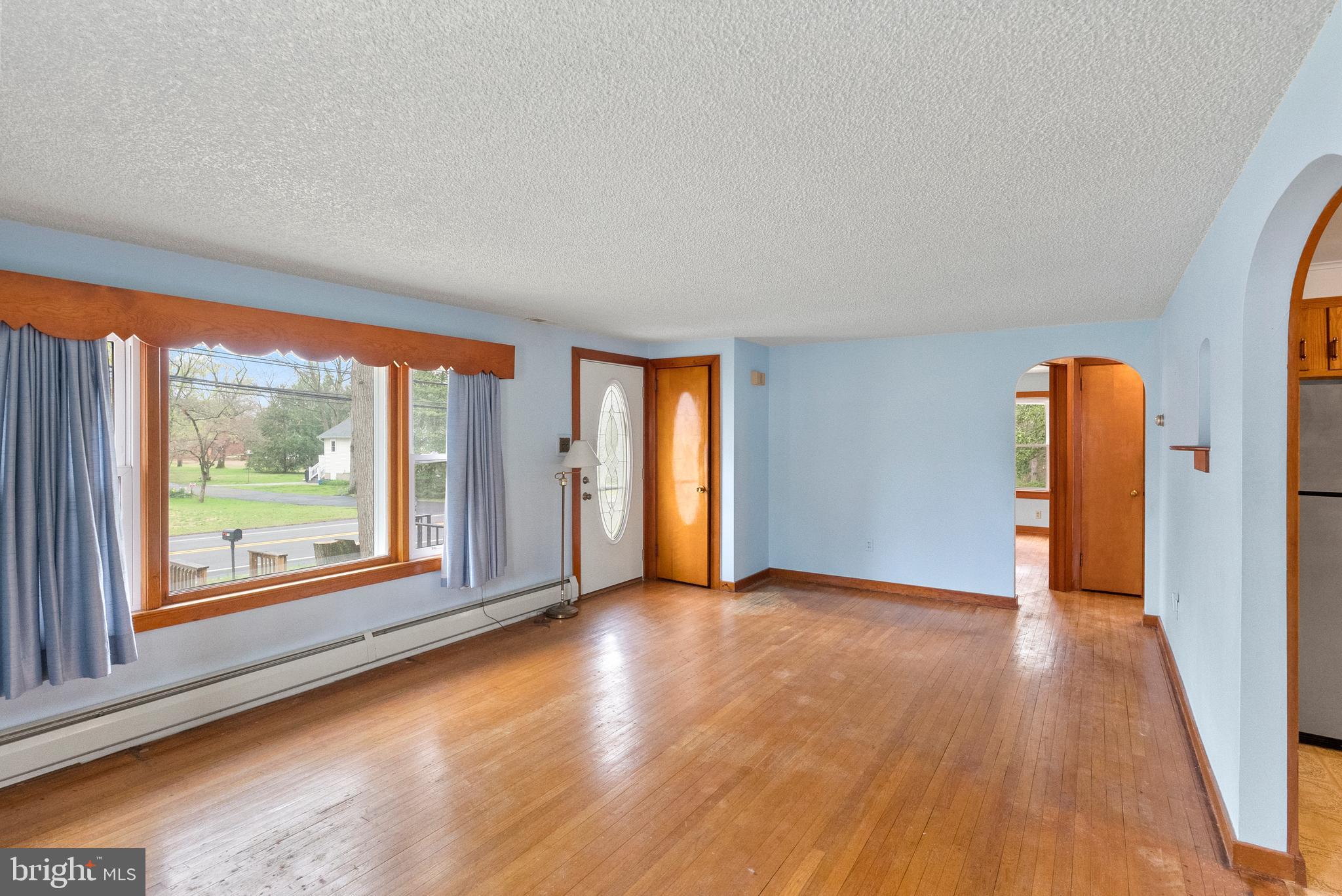 1155 South Fairview Street Delran, NJ 08075 - Photo 8 of 24 a view of an empty room with wooden floor and a window