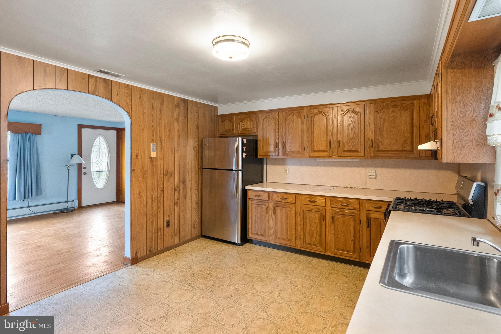1155 South Fairview Street Delran, NJ 08075 - Photo 10 of 24 a kitchen with stainless steel appliances granite countertop a refrigerator sink and cabinets