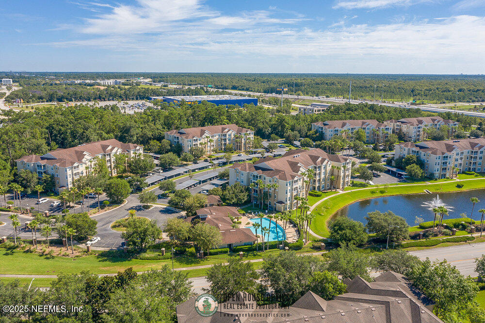 7801 Point Meadows Drive, Unit 3209 Jacksonville, FL 32256 - Photo 1 of 34 an aerial view of residential houses with outdoor space and swimming pool
