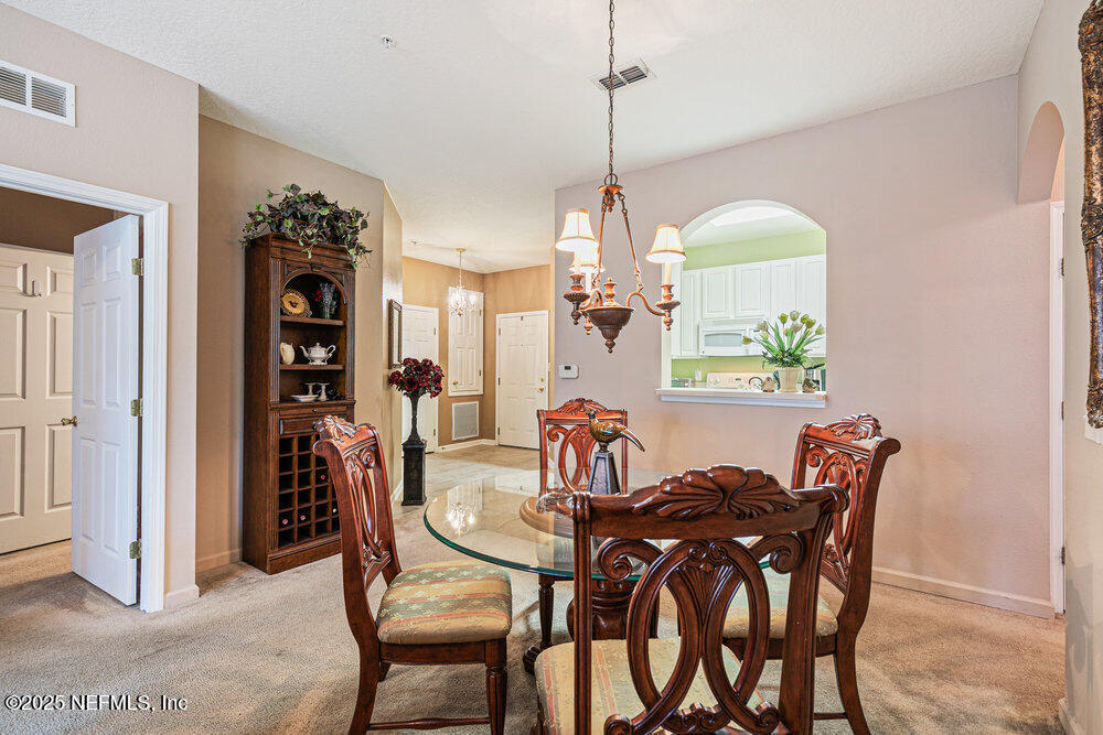 7801 Point Meadows Drive, Unit 3209 Jacksonville, FL 32256 - Photo 13 of 34 a view of a dining room with furniture
